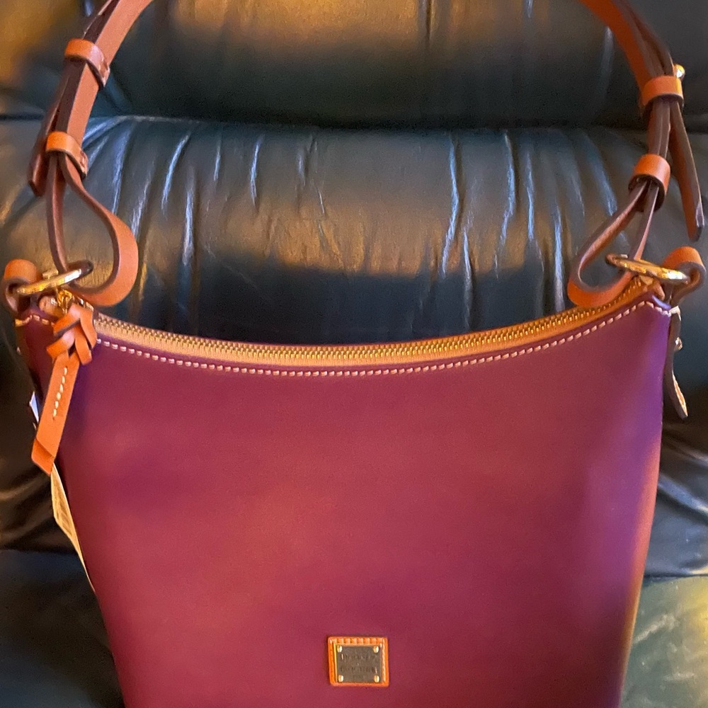 Beautiful plum-colored,Wexford leather, Dooney and Bourke, never-used